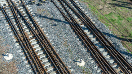 Top perspective view on many railway track lines. Railway, railroad track. Cargo and journey concepts.