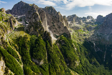 Fototapeta na wymiar Montenegro. Prokletiye National Park. Summer. Mountain range. Green mountain peaks