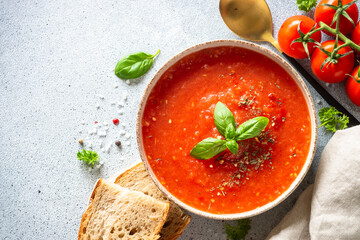 Tomato soup. Traditional vegetable soup. Top view on white background.