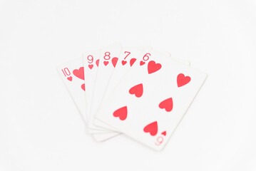 red cards of open cards on white table