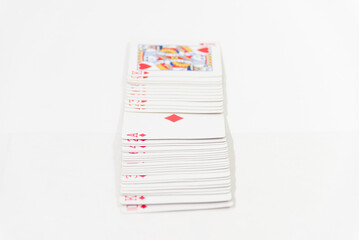 red cards of open cards on white table