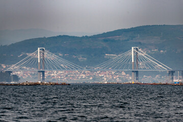 landscape of the bay of vigo with the bridge in the background - obrazy, fototapety, plakaty