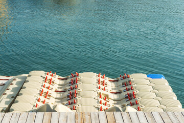 Plastic pontoon on the seashore. Pontoon at the wooden pier