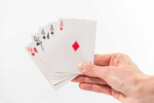 hand with shuffled cards, white background
