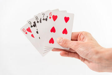 Fototapeta premium hand with shuffled cards, white background
