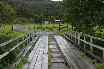 A wooden bridge stands in interior Chile, near Puerto Montt  during rain season 