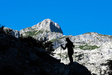 Silhouette of Female Hiker Descending from a Mountain
