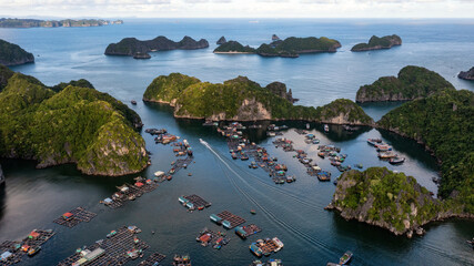 Floating fishing village and rock island in " Lan Ha " Bay, Vietnam, Southeast Asia © VietDung