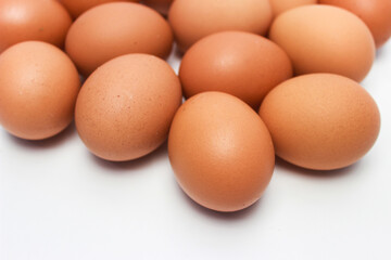 Close-Up of Fresh Raw Chicken Eggs on a White Background