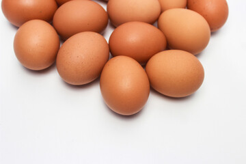 Close-Up of Fresh Raw Chicken Eggs on a White Background