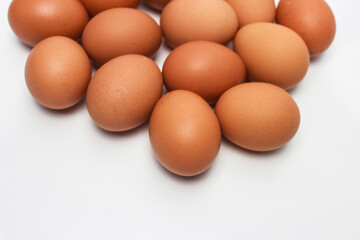 Close-Up of Fresh Raw Chicken Eggs on a White Background