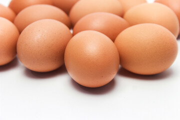Close-Up of Fresh Raw Chicken Eggs on a White Background