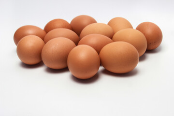 Close-Up of Fresh Raw Chicken Eggs on a White Background