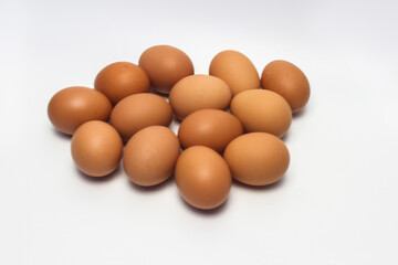 Close-Up of Fresh Raw Chicken Eggs on a White Background