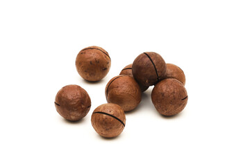 Macadamia nut on a white background. Shallow depth of field