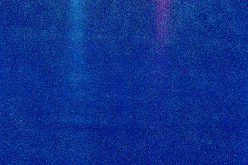 On a blue finely grained background, vertical light blue light