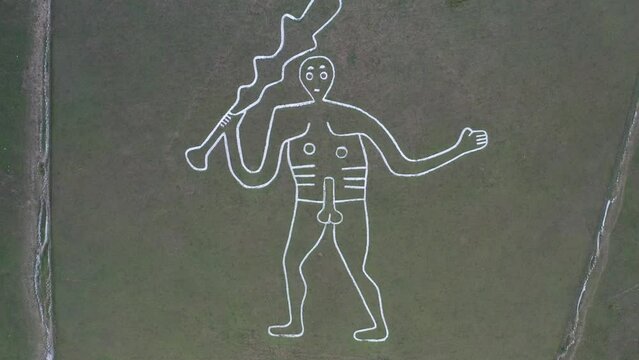 4k aerial video of The Cerne Abbas Giant is a hill figure near Cerne Abbas in Dorset, England. 55 metres high, standing nude male with a prominent erection and wielding a large club in its right hand