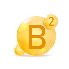 Vitamin B2 golden icon. Drop vitamin pill capsule.