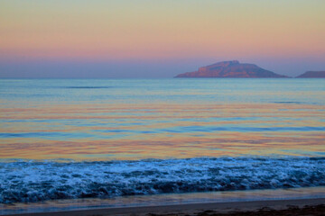 island at sunrise with beautiful colors on the pacific ocean with blue water on the coast of mazatlan sinaloa