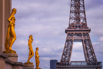 Eiffel tower from Trocadero with golden statues, Paris, France