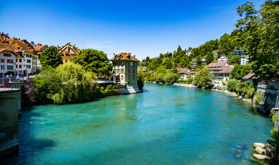 Fototapeta na wymiar The turquoise blue water of the river Aare in Bern Switzerland - travel photography