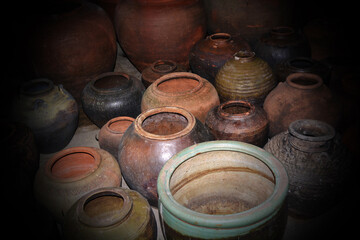 Various type of old thai hand made clay pottery.