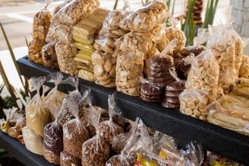 cookies in plastic bags for sale at a market stand in Brazil.