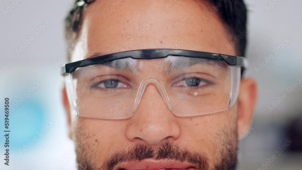 Poster happy, pleased and cheerful doctor wearing glasses while working in a lab for research. closeup port