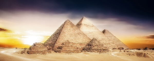 Great Pyramids of Giza, Egypt, at sunset - obrazy, fototapety, plakaty