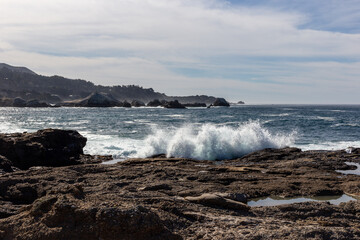 A view on Pacific ocean with rocks and waves