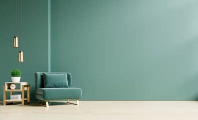 Fototapeten Wohnzimmer mit grünem Sessel auf leerem dunkelgrünem Wandhintergrund. © Vanit่jan