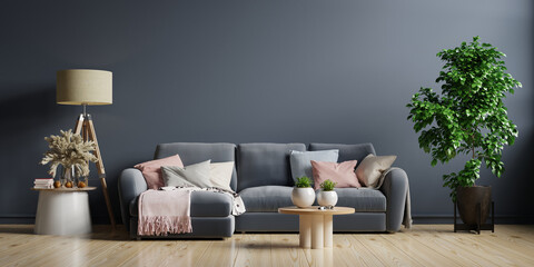Empty living room interior with sofa on empty dark blue wall background.