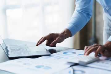 businessman working in office with using calculator and laptop. concept finance and accounting