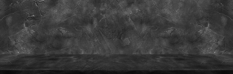 Dark black wide horizontal decorative cement wall room background with light and shadow abstract wallpaper background