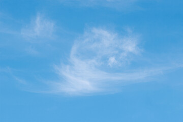 Obraz premium White clouds floated in the Blue sky on a clear day.