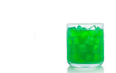 A glass of lime green soft drink isolate on white Background