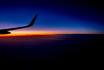 View from the plane on a beautiful orange sunset