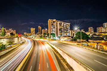 Fototapeta na wymiar evening commute on H1 Freeway at night in honolulu hawaii