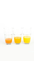 Fruit juices assortment on light background.