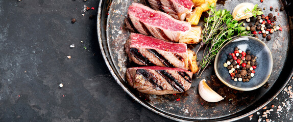 Grilled beef steak with pepper and salt.