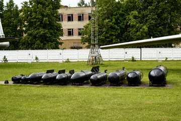 heavy bombs on the airfield under the fuselage of a bomber