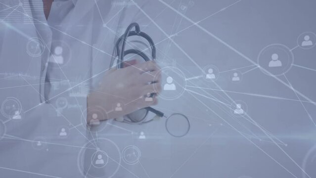 Animation of network of connections over caucasian doctor with stethoscope