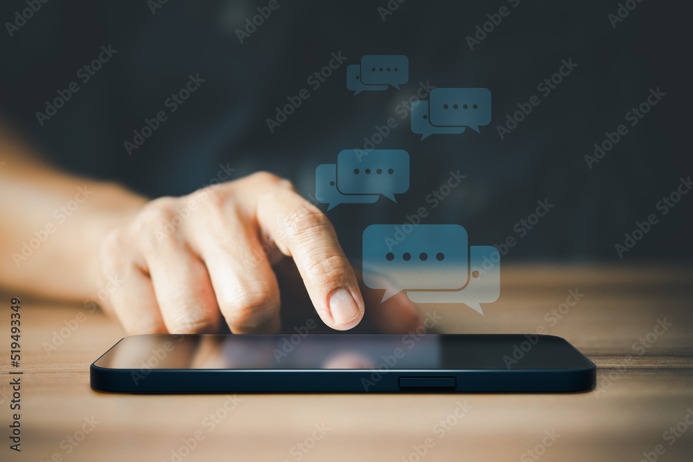 Poster Man hand using smartphone typing live chat chatting on application communication digital web and social network concept. Social media application chat box.