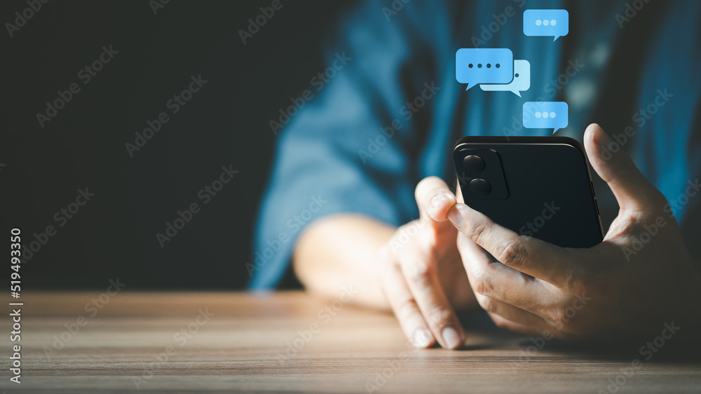 Poster Man hand using smartphone typing live chat chatting on application communication digital web and social network concept. Social media application chat box.
