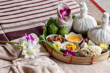 Obraz na płótnie Canvas Natural thai aroma massage in thai spa Thai Spa aromatherapy. Massage spa body treatment aroma for healthy.Lifestyle Healthy Concept. female face healthy life luxury relaxation scrub treatment