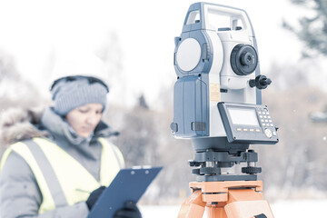 female civil engineer, wearing a white helmet on a construction site close-up