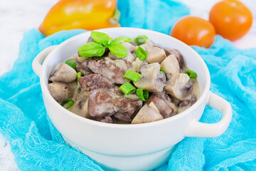 Beef stroganoff chicken liver and mushrooms on white background