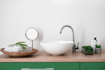 Interior of light bathroom with sink