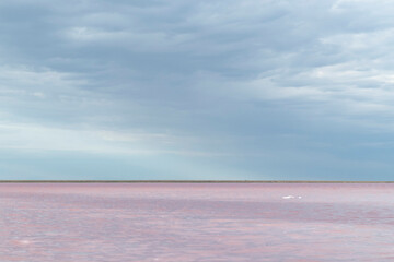 clouds over pink salt lake