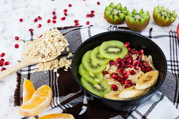 Healthy breakfast. Oatmeal with fruit on white background